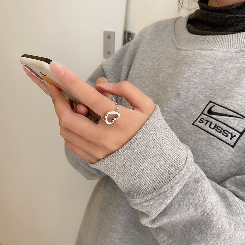 Anillo ajustable de corazón abierto de metal negro al por mayor