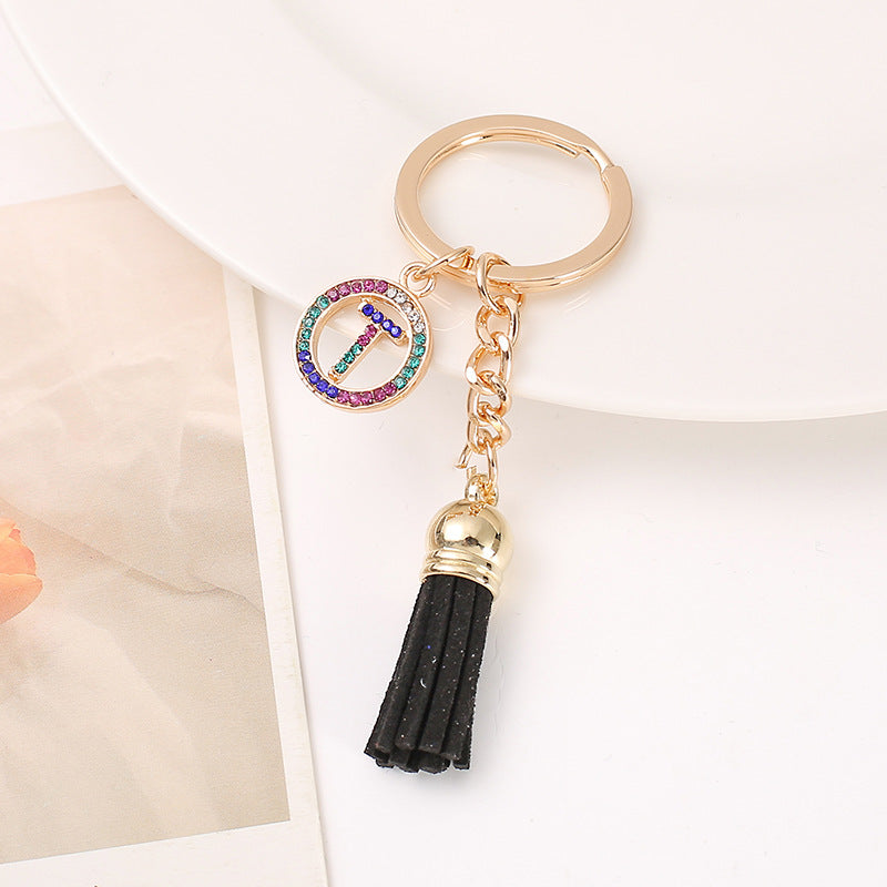 Venta al por mayor Llavero del alfabeto inglés de la borla de la aleación del cinc