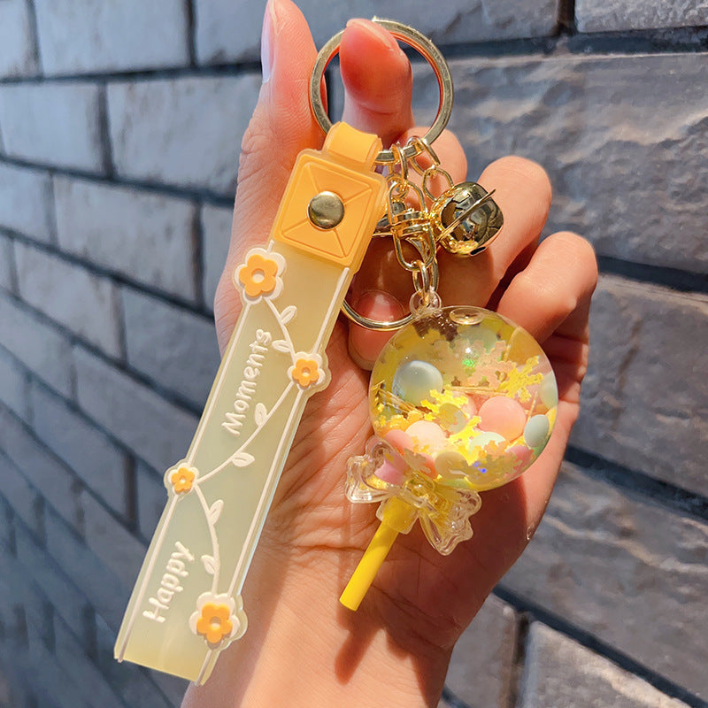 Piruleta de acrílico al por mayor en el llavero creativo de la arena movediza del aceite