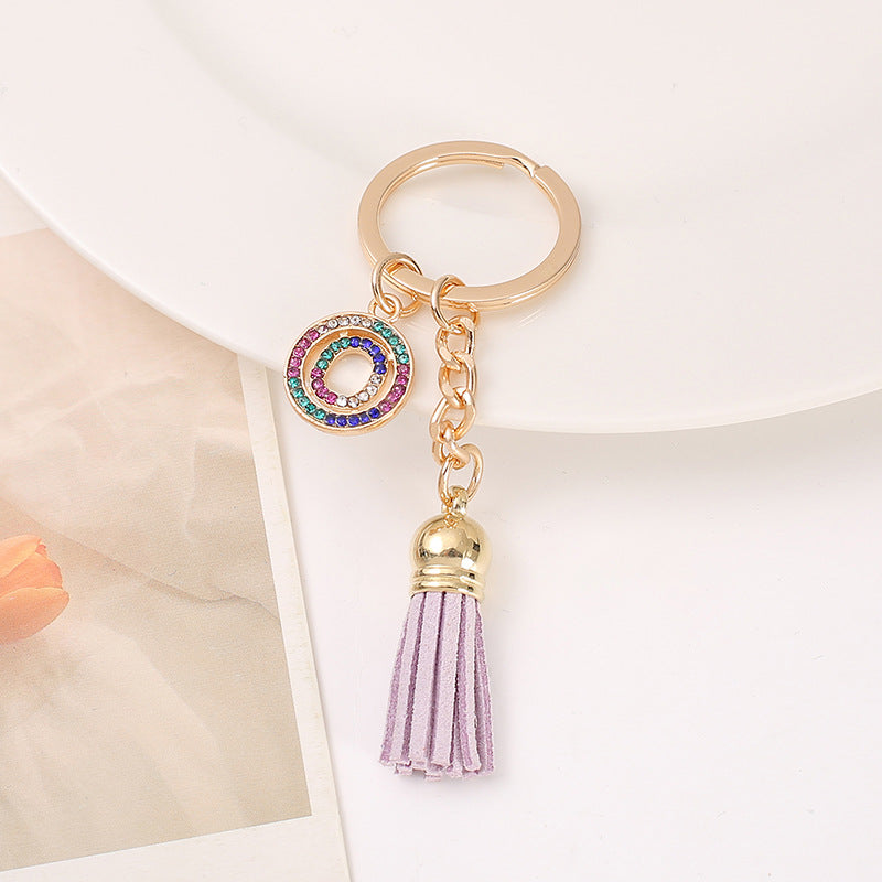 Venta al por mayor Llavero del alfabeto inglés de la borla de la aleación del cinc