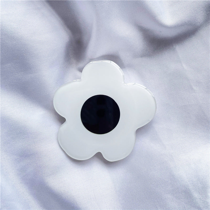 Venta al por mayor Torta de simulación Acrílico Airbag Soporte para teléfono móvil