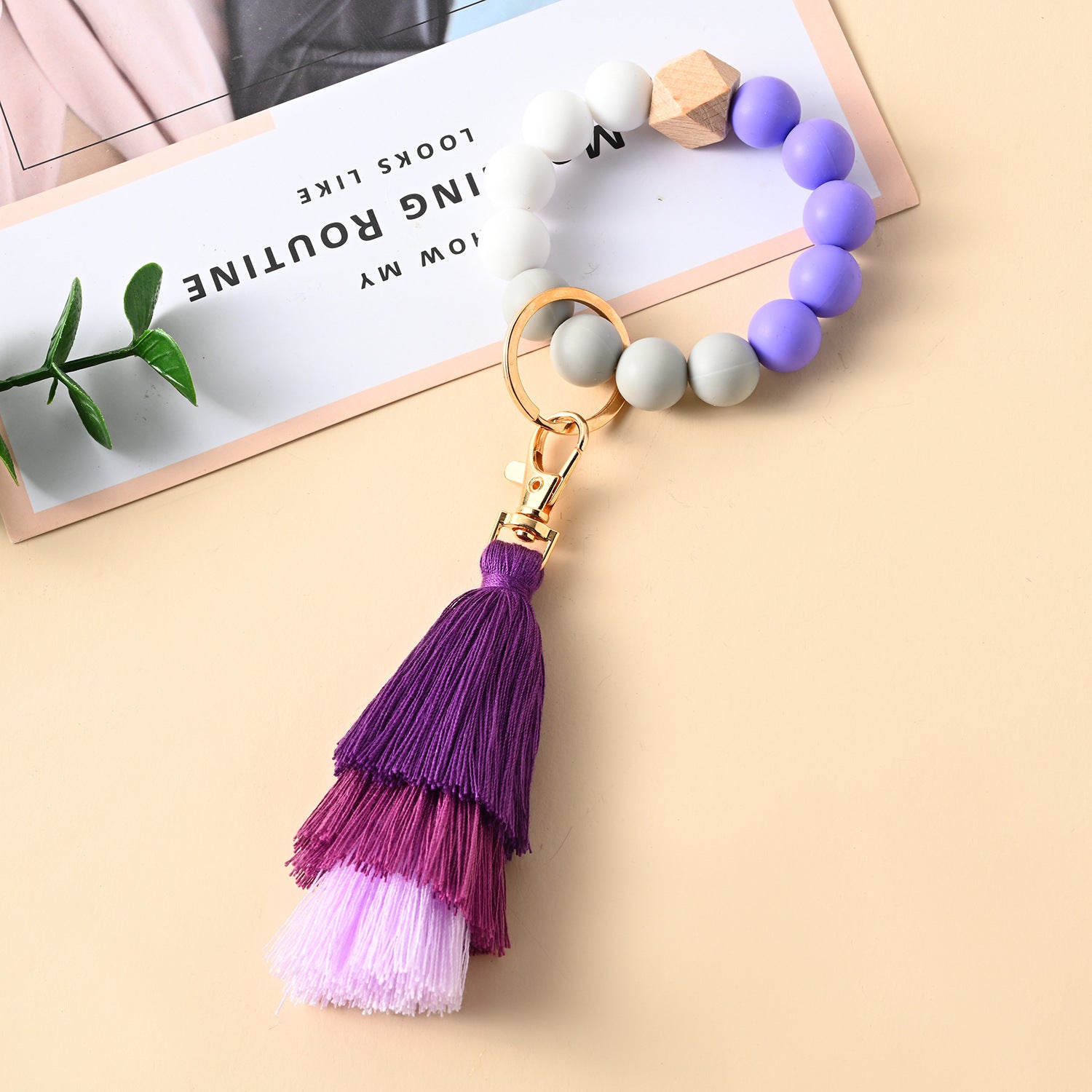 Venta al por mayor Llavero de la pulsera del grano del silicón de la borla