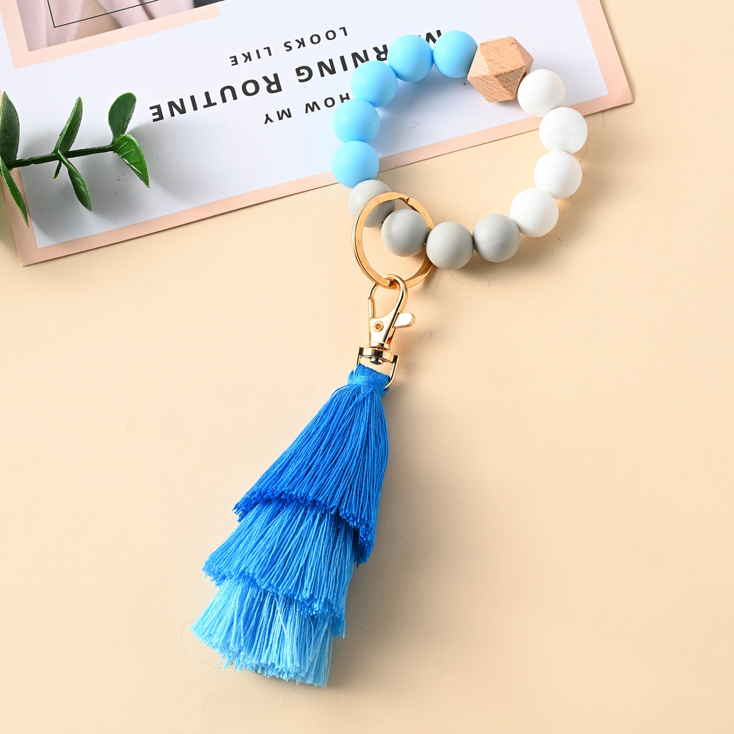 Venta al por mayor Llavero de la pulsera del grano del silicón de la borla