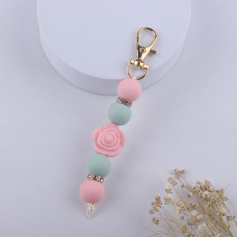 Llavero con cuentas de silicona rosa de doble cara al por mayor