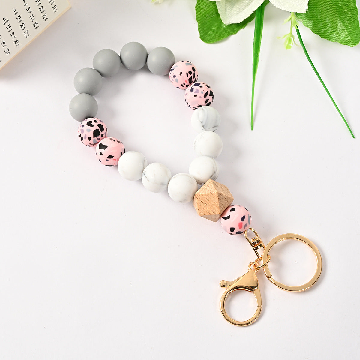 Venta al por mayor Llavero de la pulsera del grano del silicón de la borla