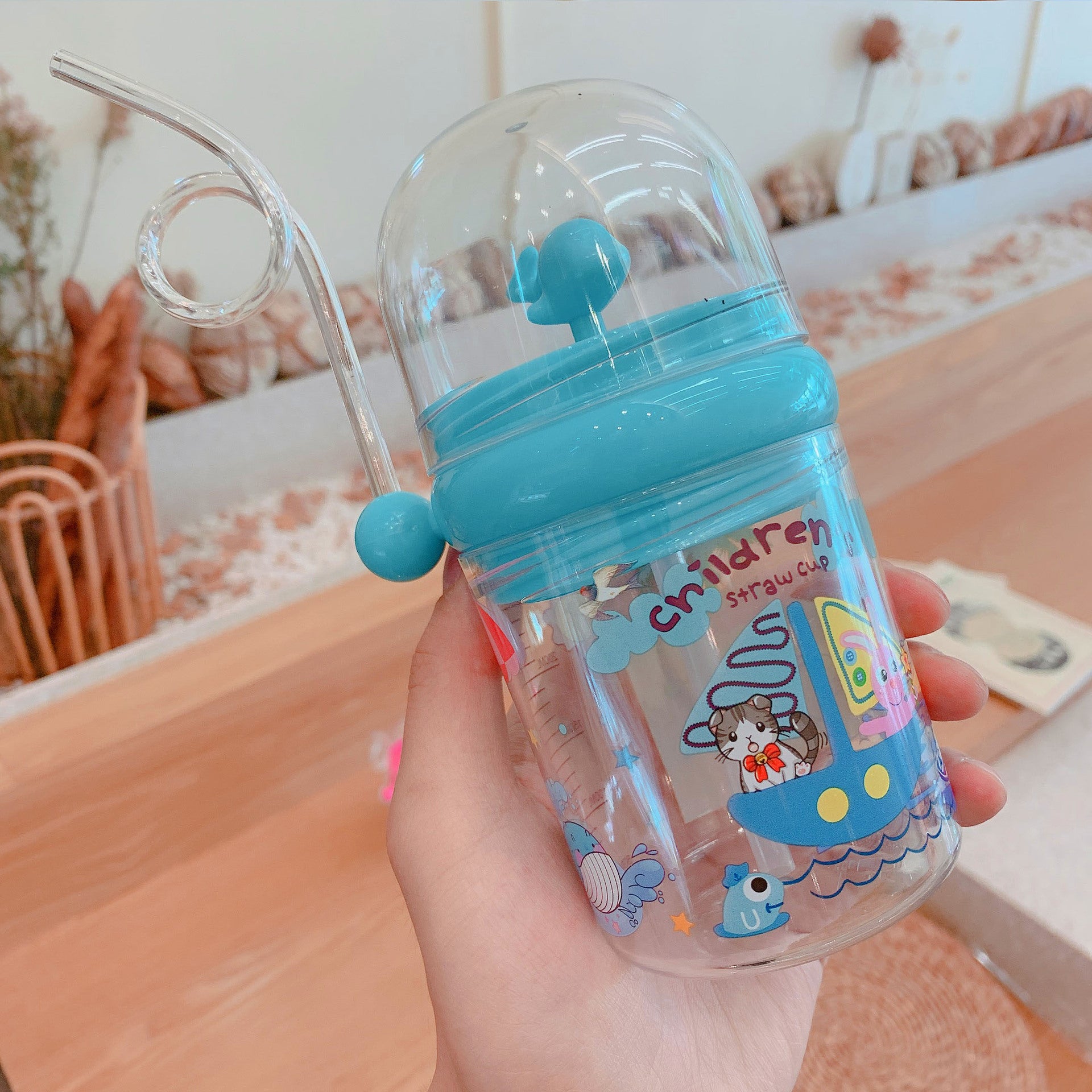 Wholesale Water spray whale cup children's portable anti-fall plastic cup with scale windmill