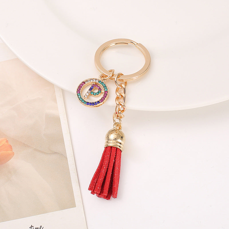 Venta al por mayor Llavero del alfabeto inglés de la borla de la aleación del cinc