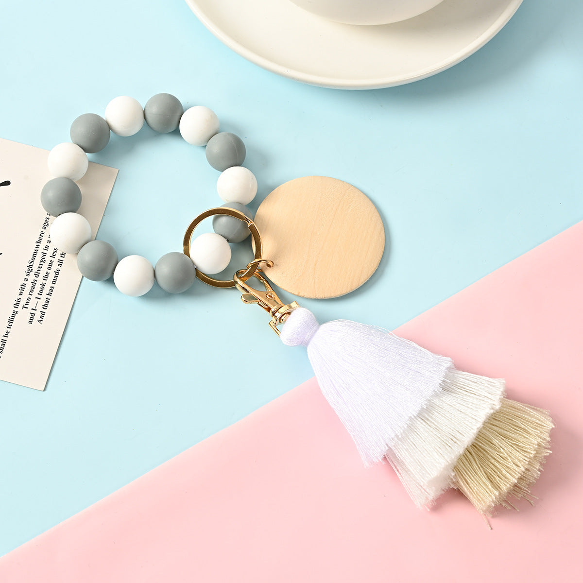 Venta al por mayor Llavero de la pulsera del grano del silicón de la borla