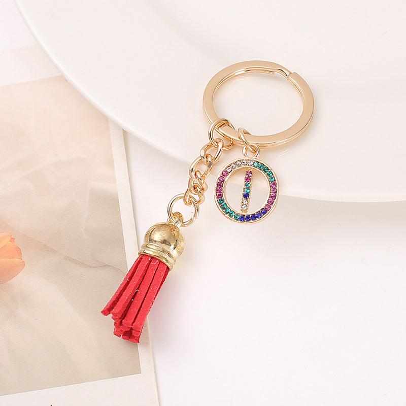 Venta al por mayor Llavero del alfabeto inglés de la borla de la aleación del cinc