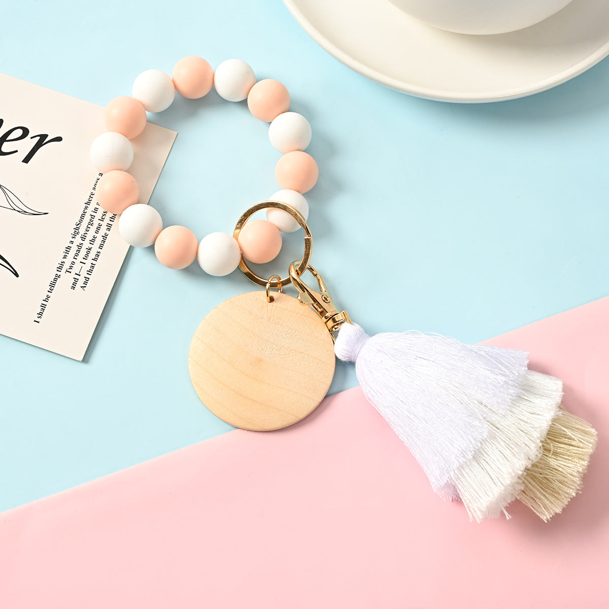 Venta al por mayor Llavero de la pulsera del grano del silicón de la borla