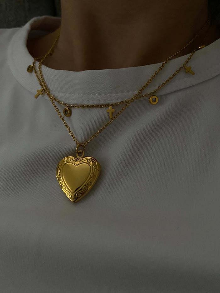 Venta al por mayor Collar de marco de foto con tirón de corazón francés de acero de titanio