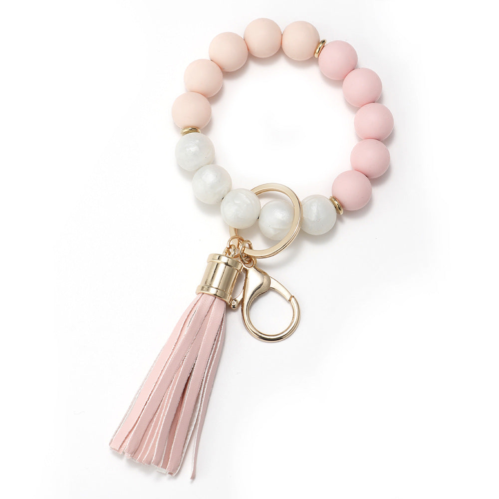 Venta al por mayor Llavero de muñeca de borla con cuentas de silicona