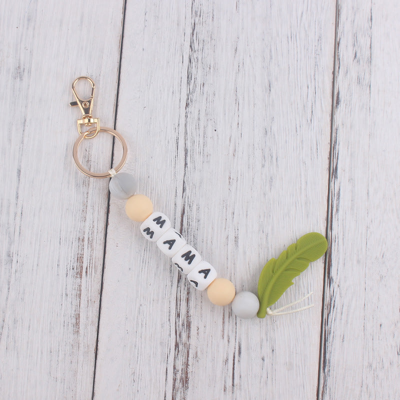 Llavero de plumas con cuentas de silicona colorida al por mayor