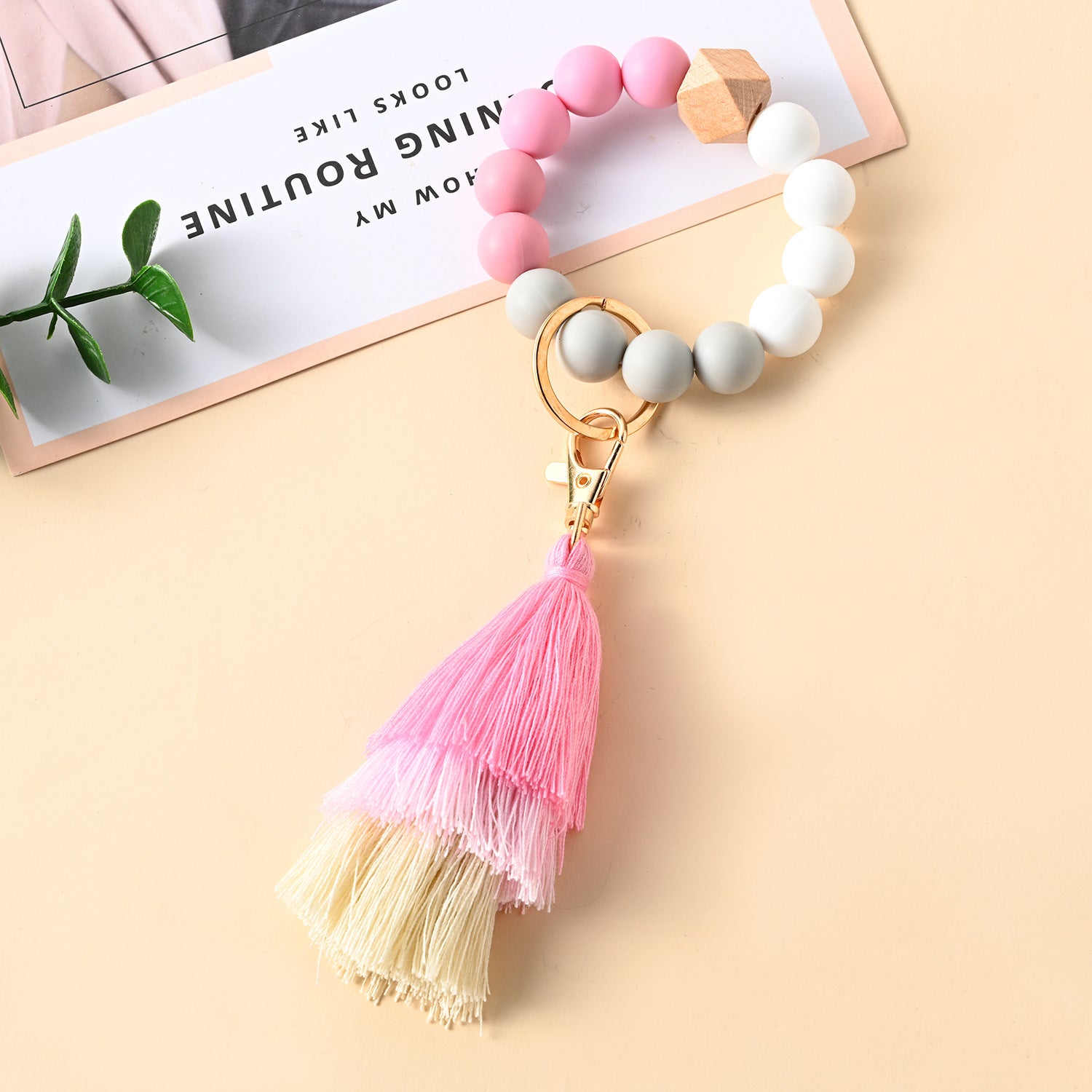 Venta al por mayor Llavero de la pulsera del grano del silicón de la borla