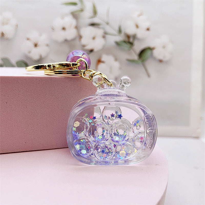 Comercio al por mayor acrílico transparente líquido arenas movedizas llavero creativo