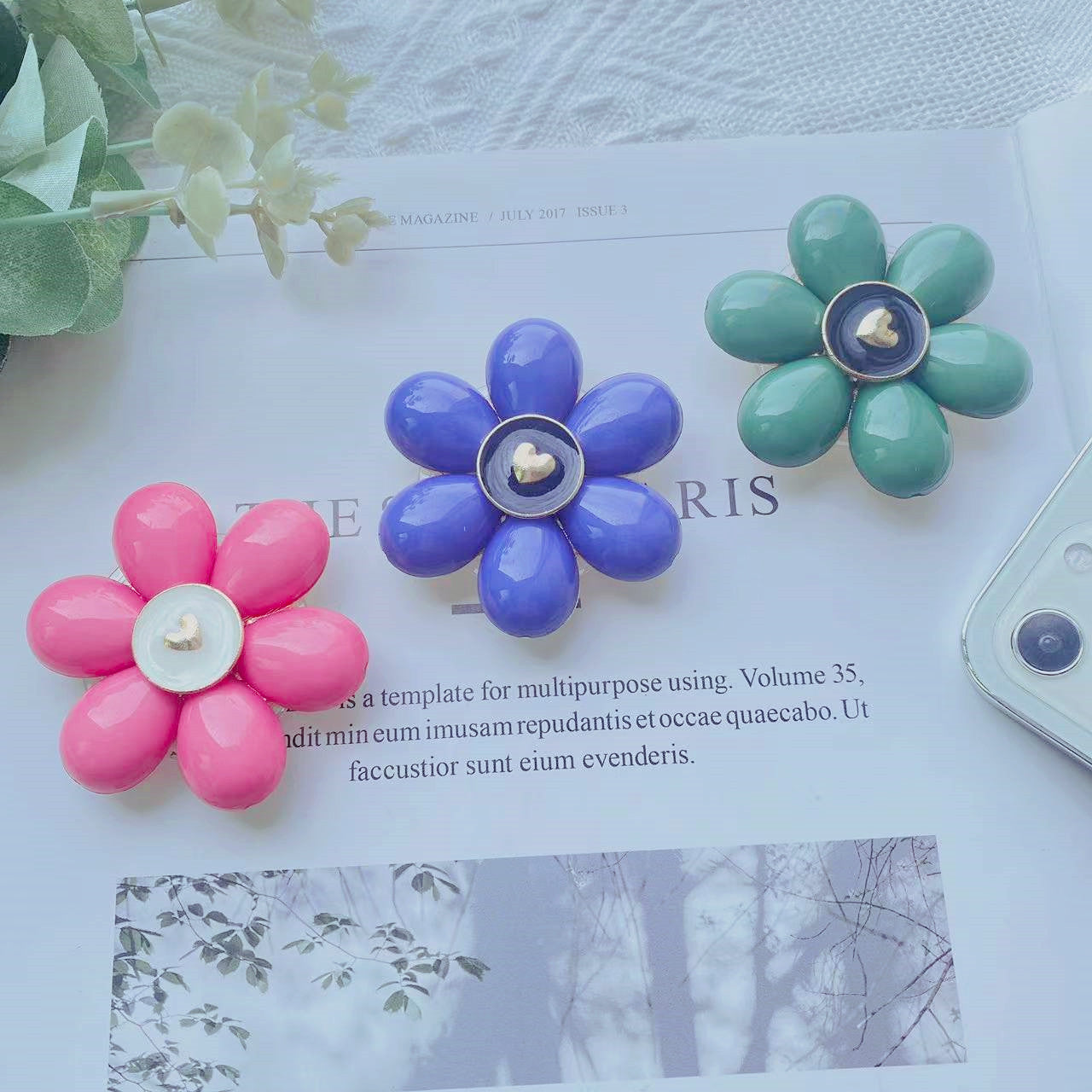 Soporte de teléfono móvil plegable Camellia de resina al por mayor