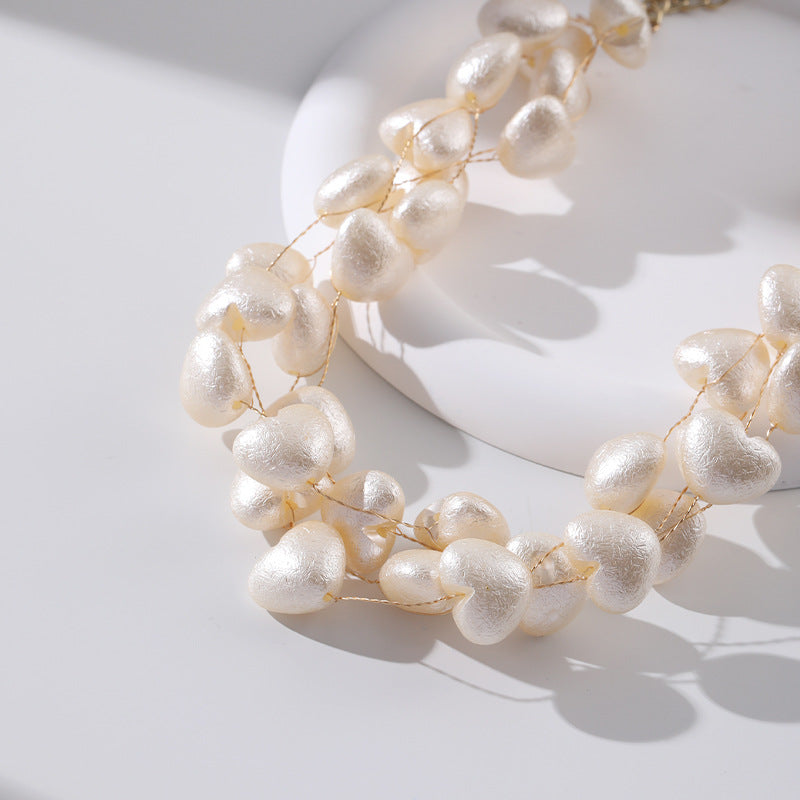 Collar multicapa en forma de corazón tejido con perlas de imitación al por mayor