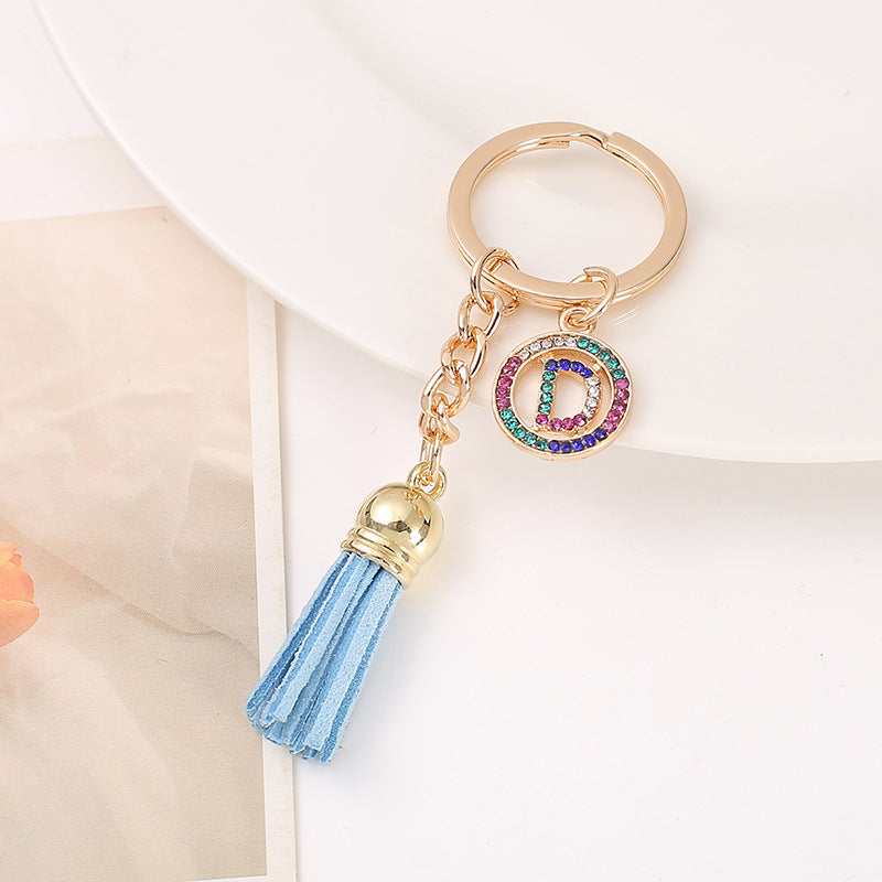 Venta al por mayor Llavero del alfabeto inglés de la borla de la aleación del cinc