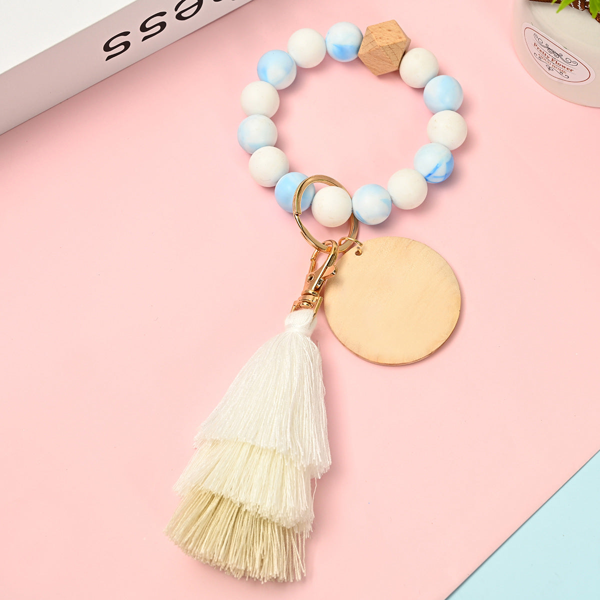 Venta al por mayor Llavero de la pulsera del grano del silicón de la borla