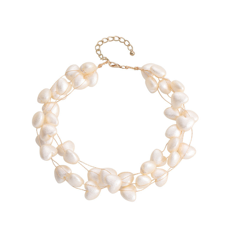 Collar multicapa en forma de corazón tejido con perlas de imitación al por mayor