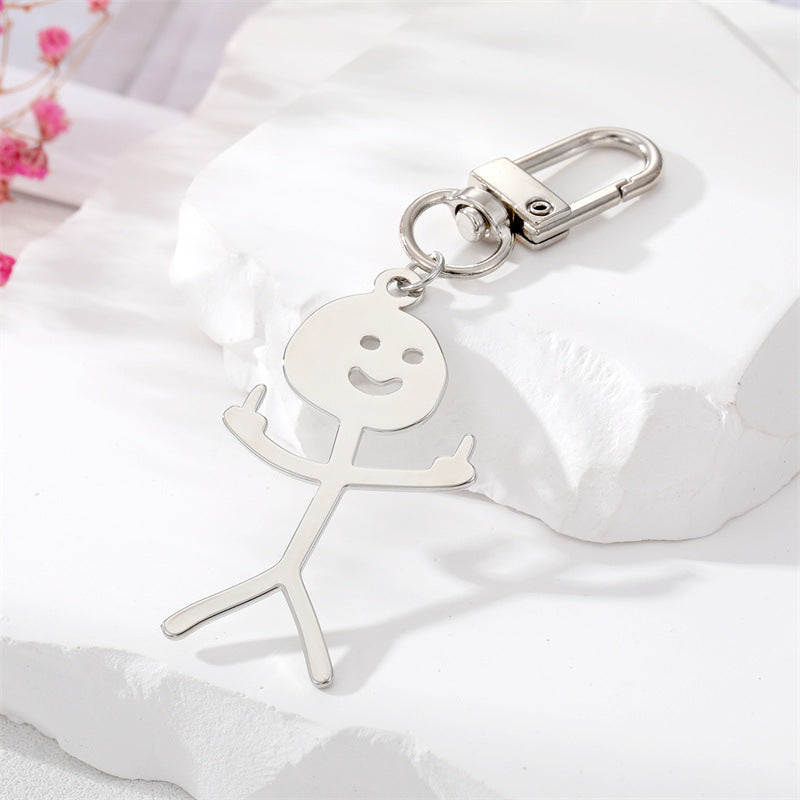 Comercio al por mayor de dibujos animados de acero inoxidable Graffiti dedo medio villano llavero