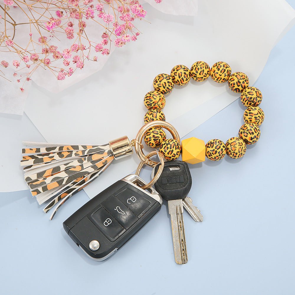 Llavero de muñeca con cuentas de madera con patrón manchado al por mayor