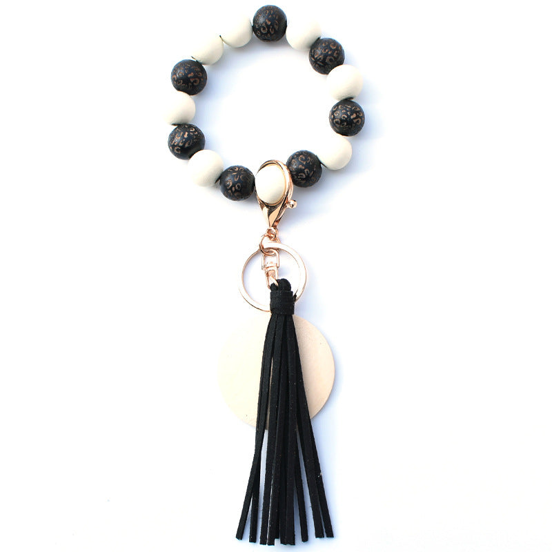 Venta al por mayor PU impreso borla colgante muñeca llavero