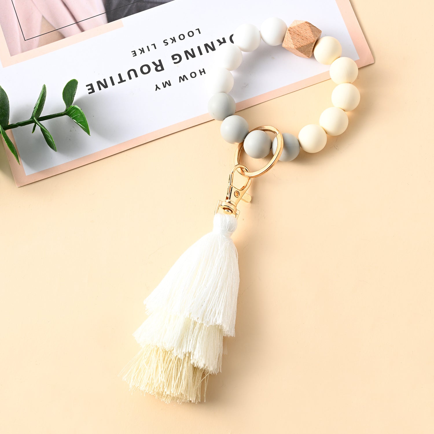 Venta al por mayor Llavero de la pulsera del grano del silicón de la borla