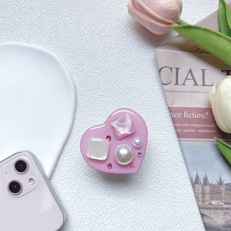 Soporte para teléfono móvil con bolsa de aire de amor de gema de plástico al por mayor