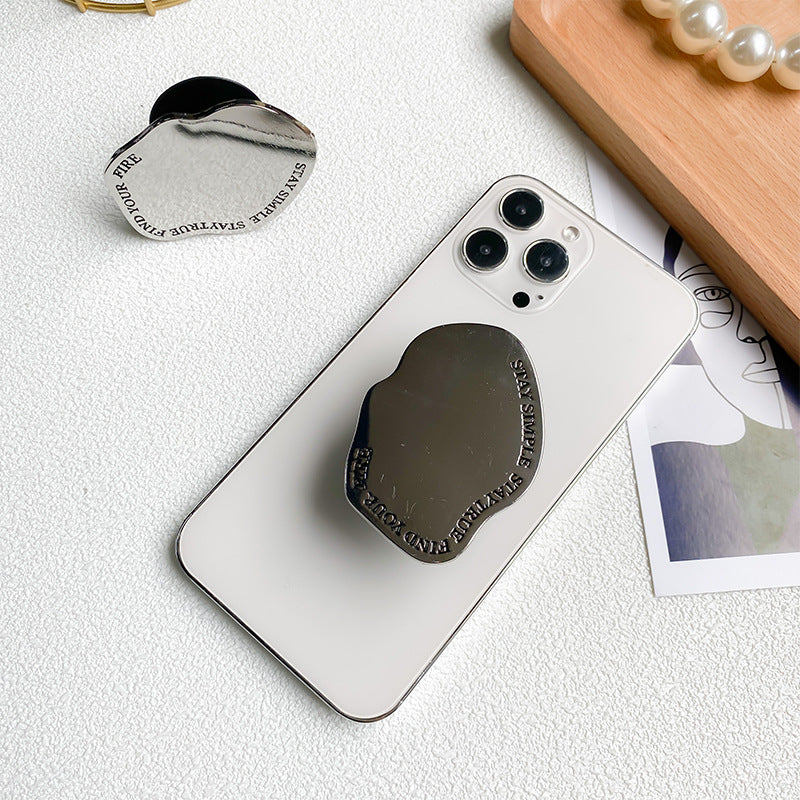 Soporte para teléfono móvil con airbag de escritorio retráctil de pasta de espejo de metal al por mayor