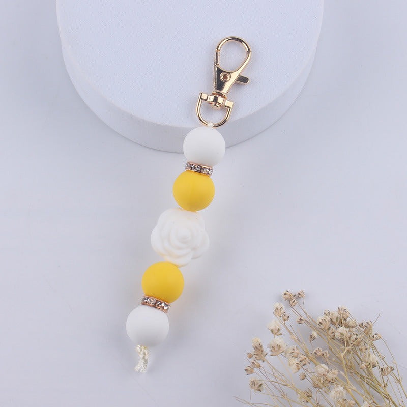 Llavero con cuentas de silicona rosa de doble cara al por mayor