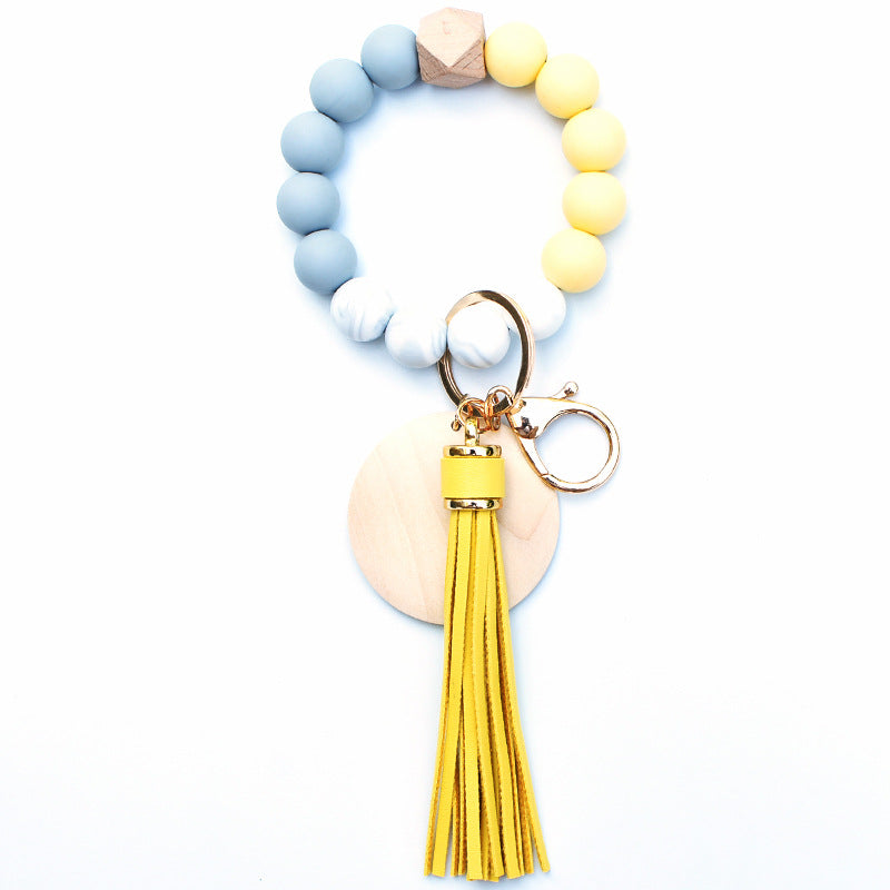 Llavero de muñeca de cuentas de madera con borla de silicona al por mayor