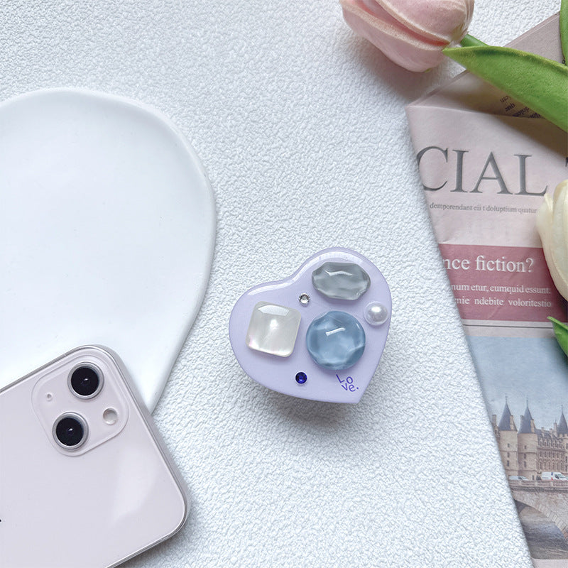 Soporte para teléfono móvil con bolsa de aire de amor de gema de plástico al por mayor