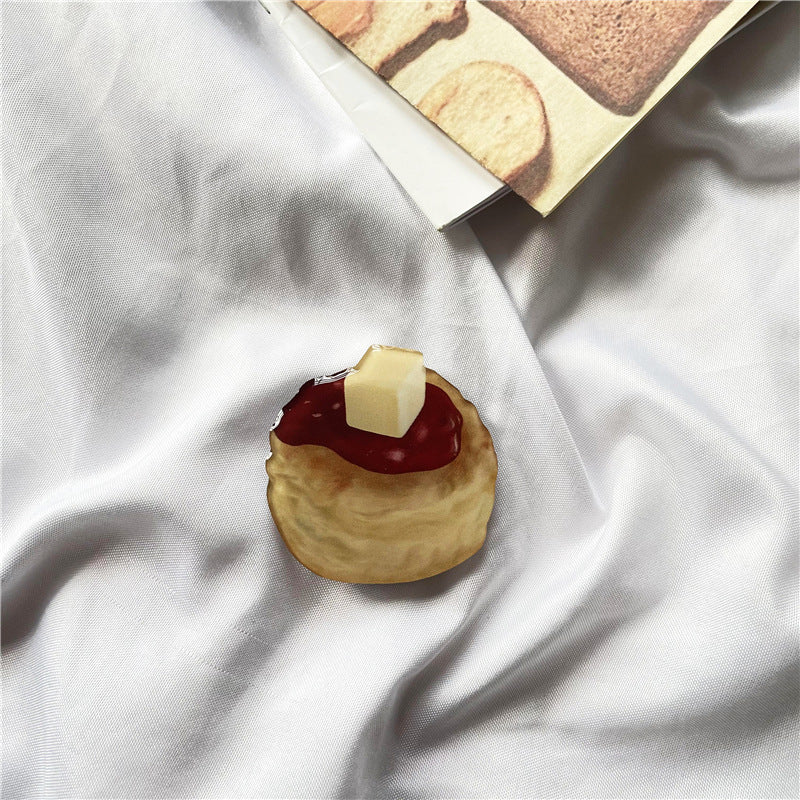 Venta al por mayor Torta de simulación Acrílico Airbag Soporte para teléfono móvil