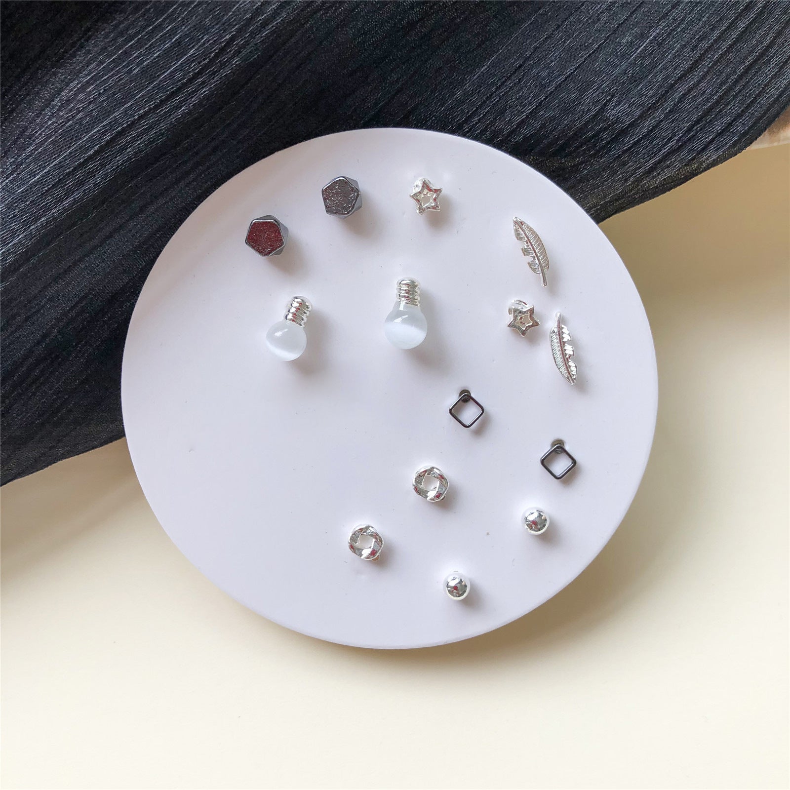 Venta al por mayor Conjunto de aretes de una semana Aretes de aleación