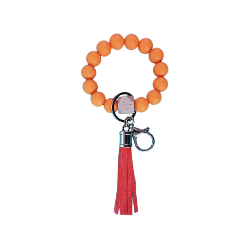 Venta al por mayor Llavero de muñeca con cuentas de silicona de girasol