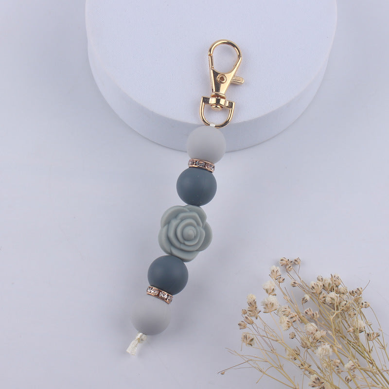 Llavero con cuentas de silicona rosa de doble cara al por mayor