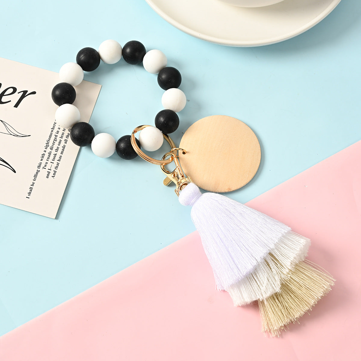 Venta al por mayor Llavero de la pulsera del grano del silicón de la borla