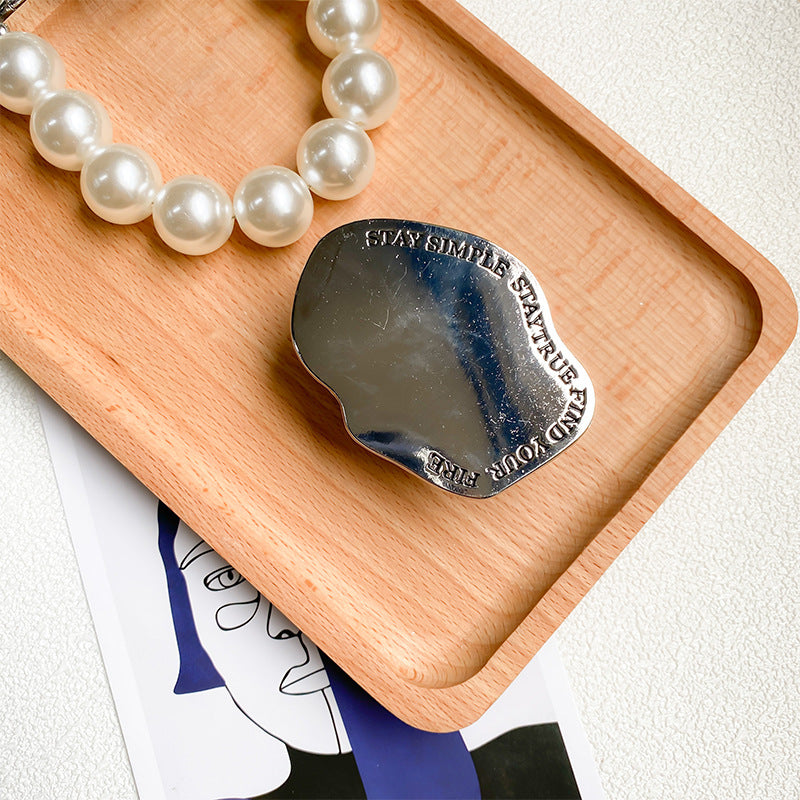 Soporte para teléfono móvil con airbag de escritorio retráctil de pasta de espejo de metal al por mayor