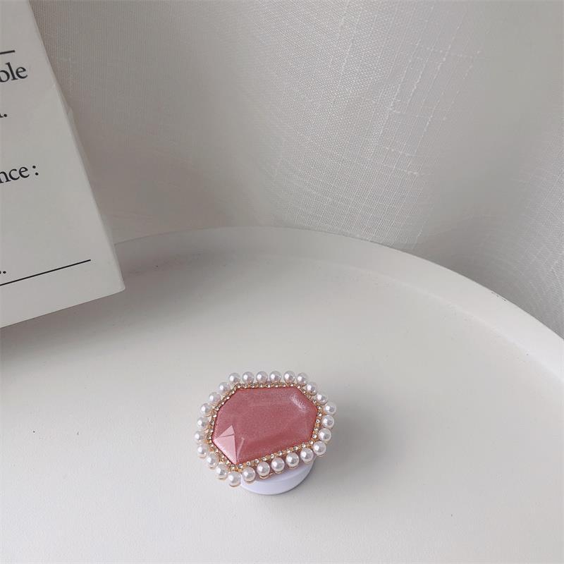 Venta al por mayor Soporte para teléfono móvil de perlas de piedras preciosas