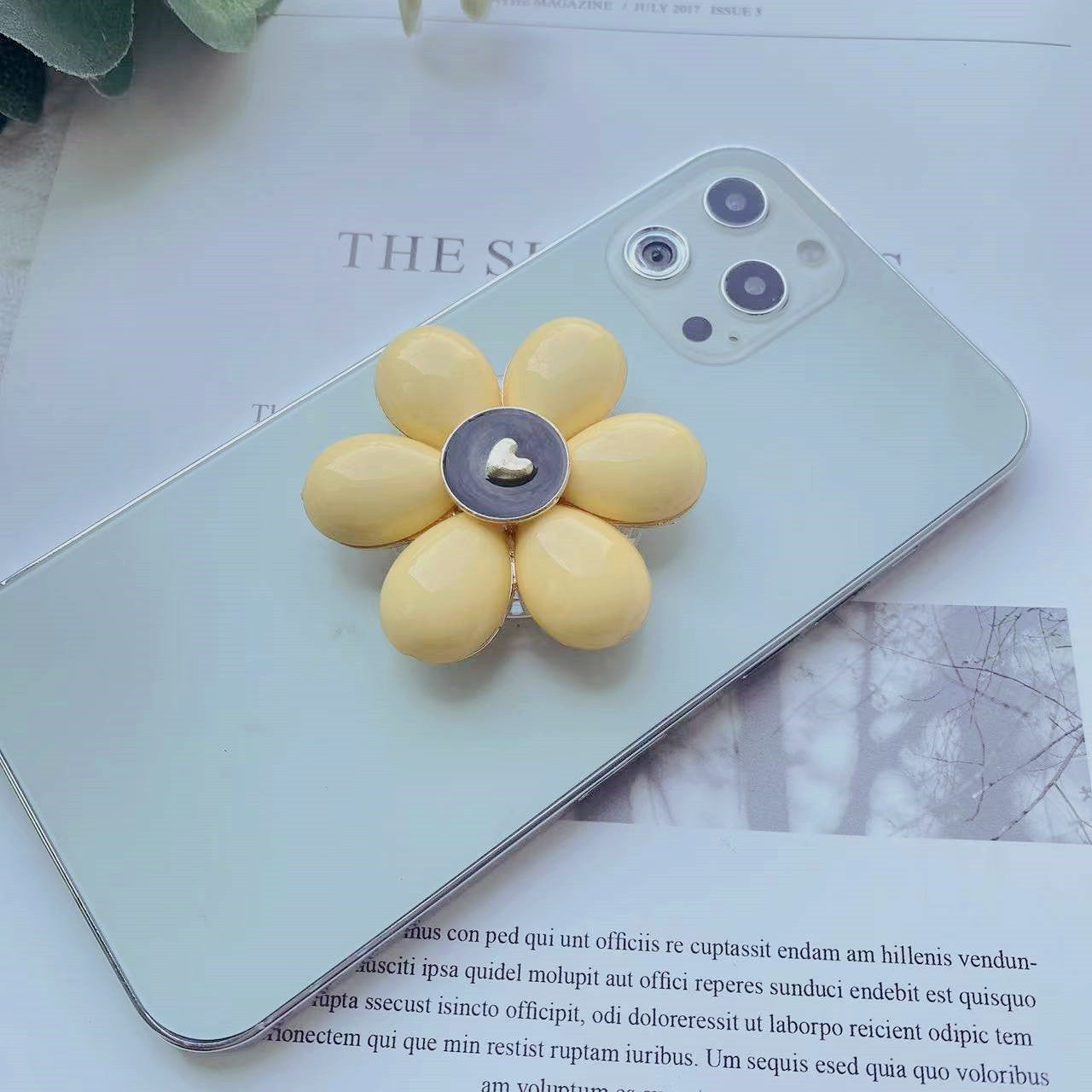 Soporte de teléfono móvil plegable Camellia de resina al por mayor