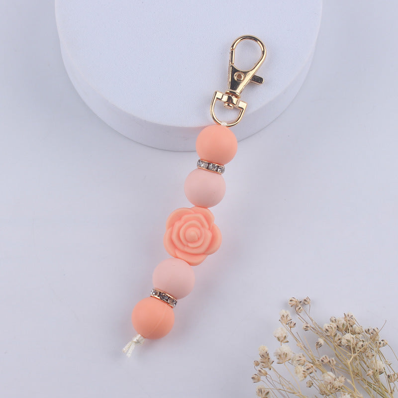 Llavero con cuentas de silicona rosa de doble cara al por mayor