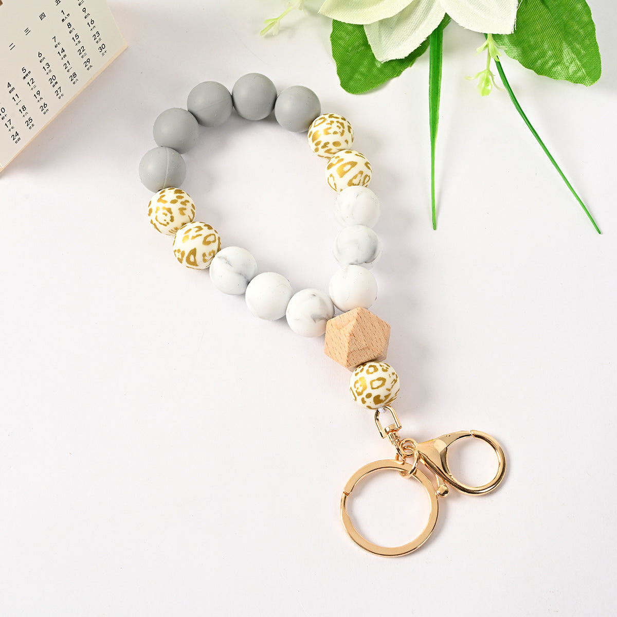 Venta al por mayor Llavero de la pulsera del grano del silicón de la borla