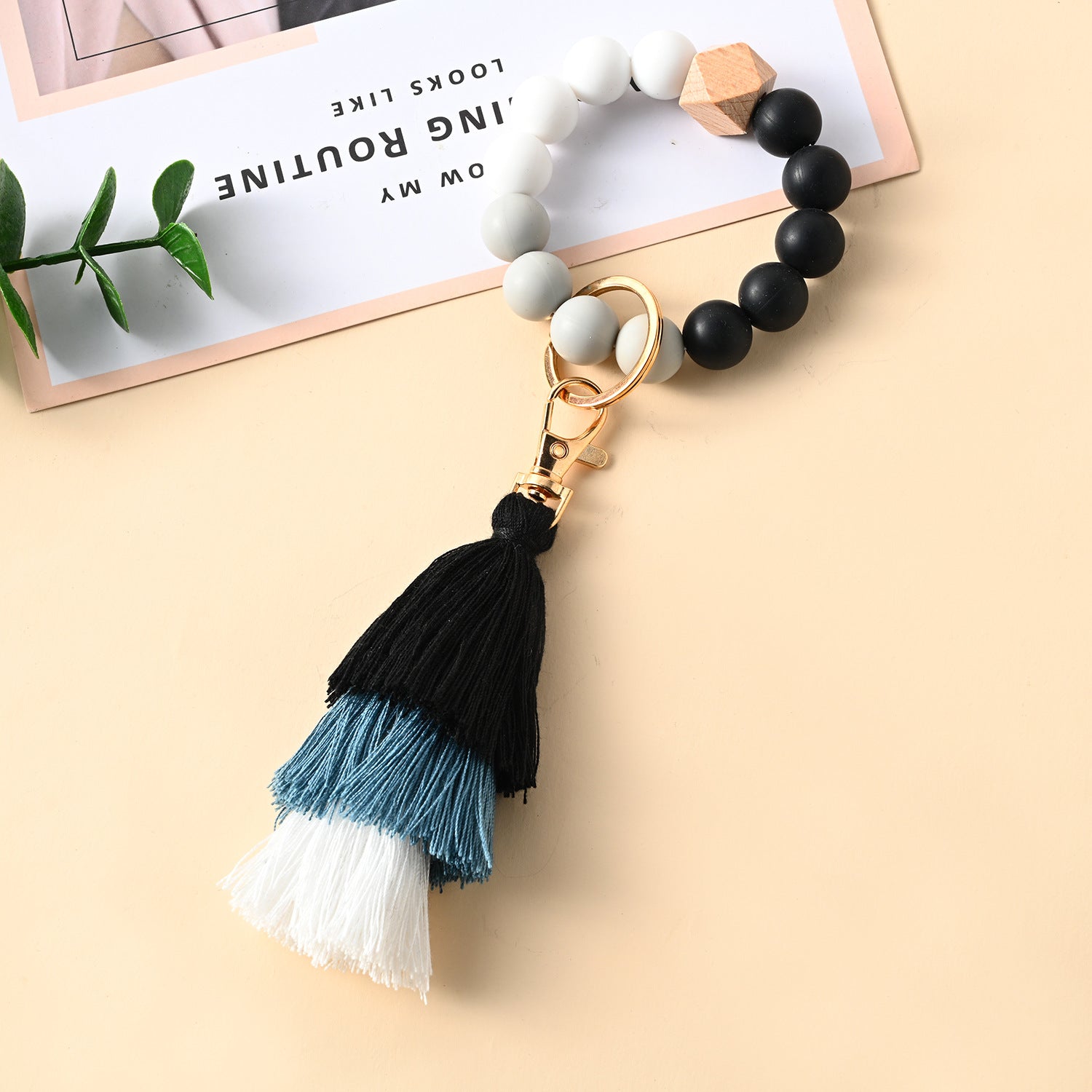 Venta al por mayor Llavero de la pulsera del grano del silicón de la borla