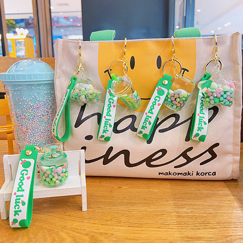 Wholesale Acrylic Green Liquid Into The Oil Quicksand Bottle Series Key Chain