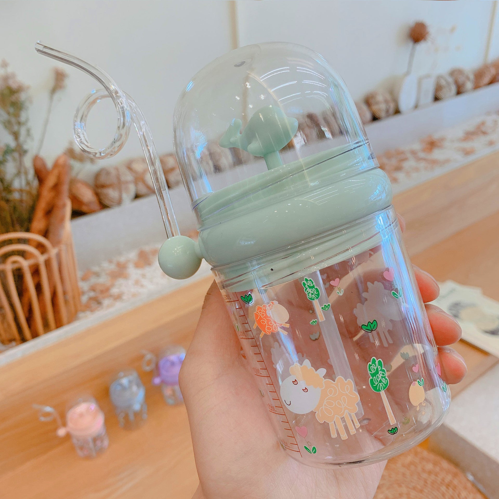 Wholesale Water spray whale cup children's portable anti-fall plastic cup with scale windmill