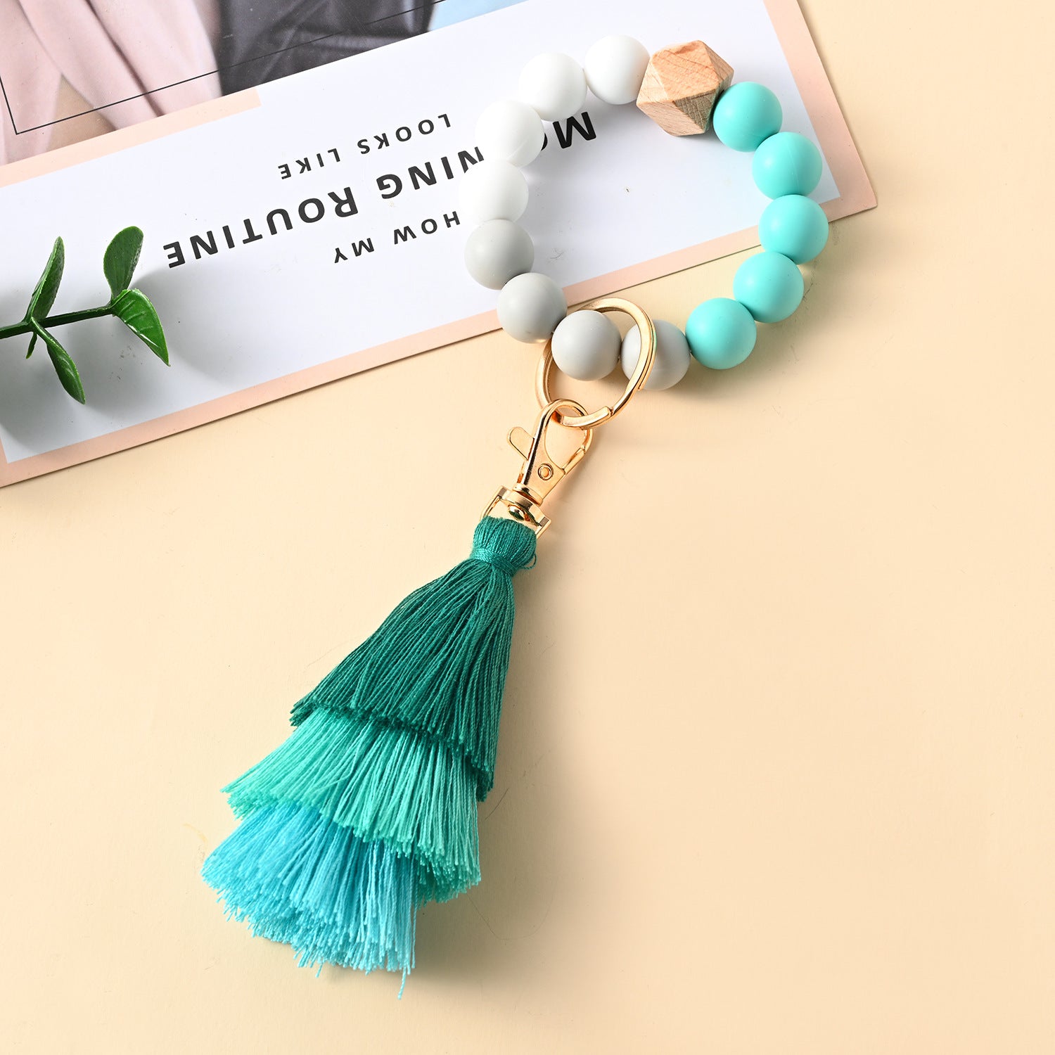 Venta al por mayor Llavero de la pulsera del grano del silicón de la borla