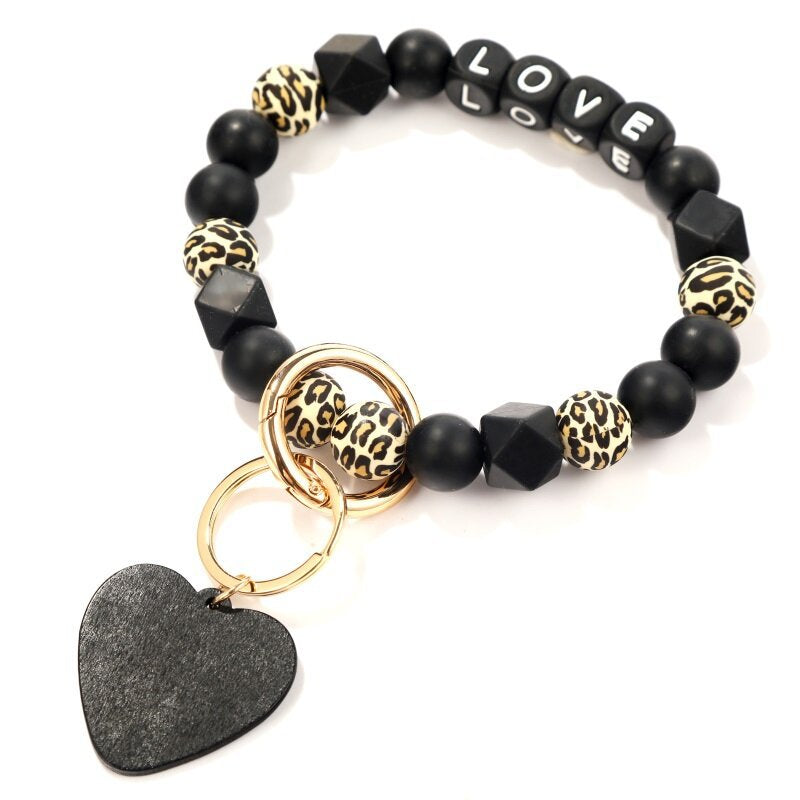 Venta al por mayor, corazón negro, patrón de leopardo, silicona, moldeado, muñeca, llavero