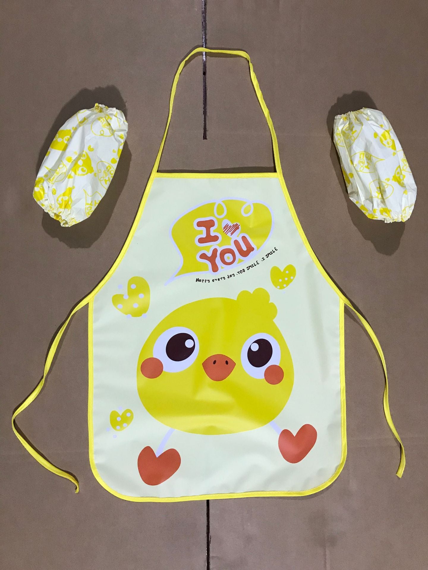 Delantal impermeable al por mayor de los niños de la historieta del PE