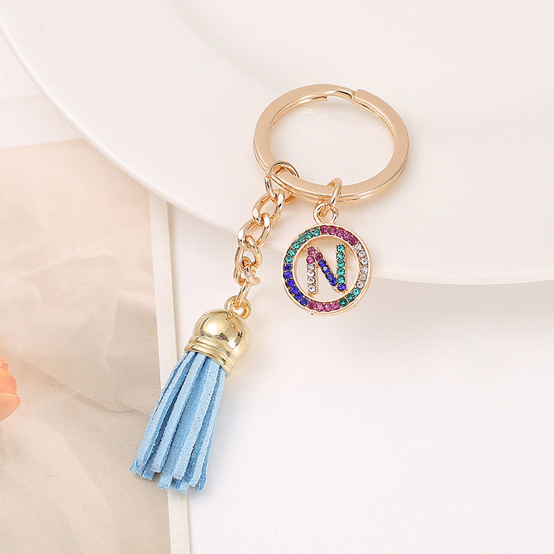 Venta al por mayor Llavero del alfabeto inglés de la borla de la aleación del cinc